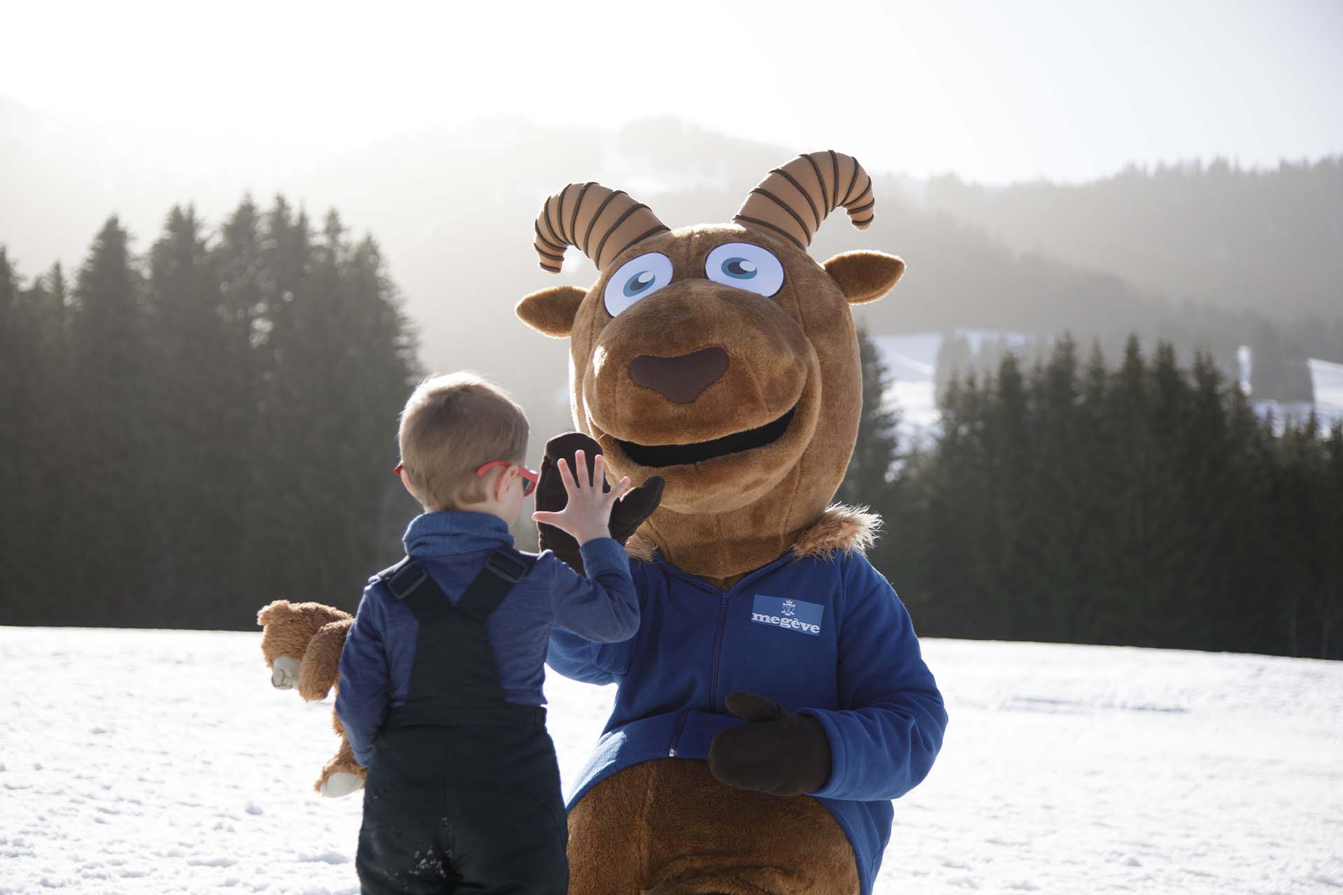 Billy Bosteu Mascot and a child at Livraz